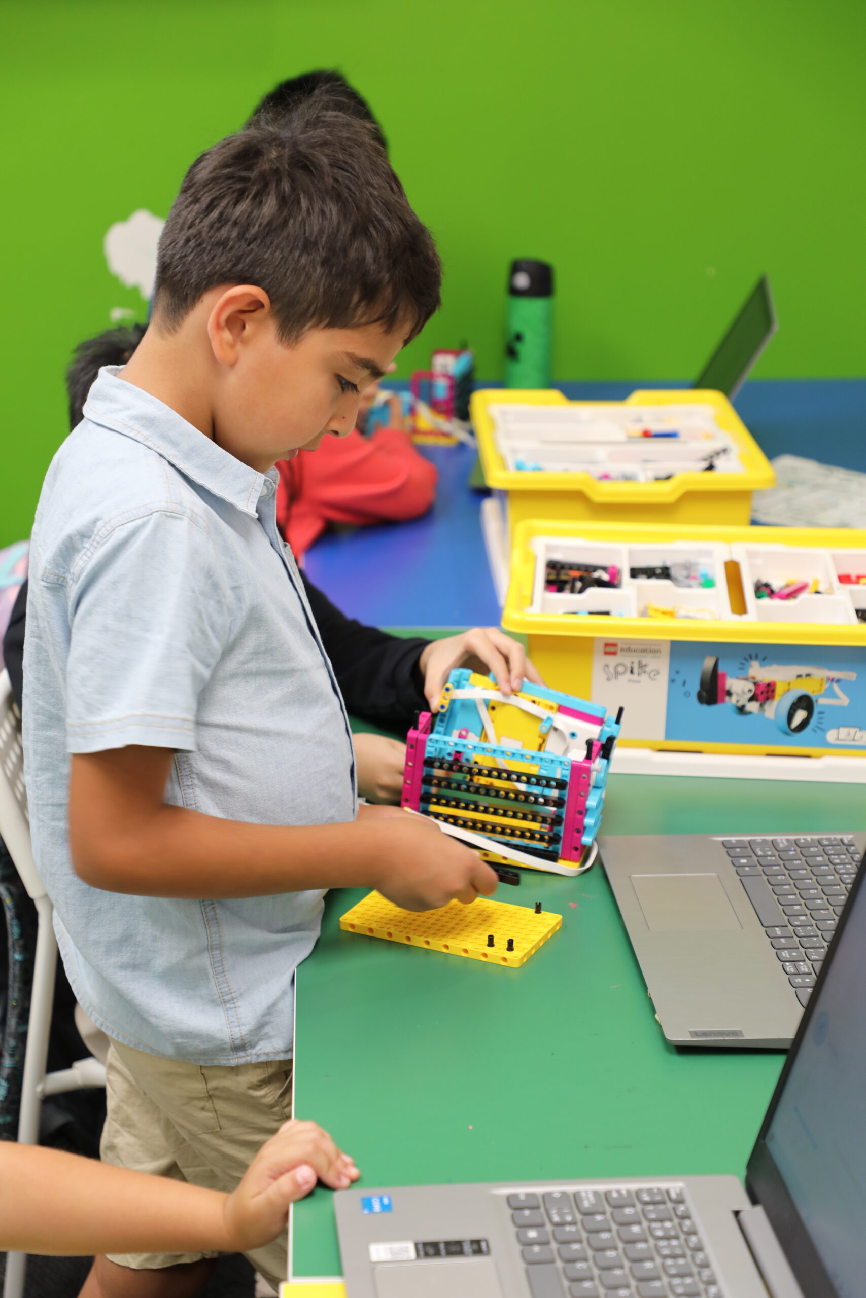Students learning coding and robotics through hands-on projects
