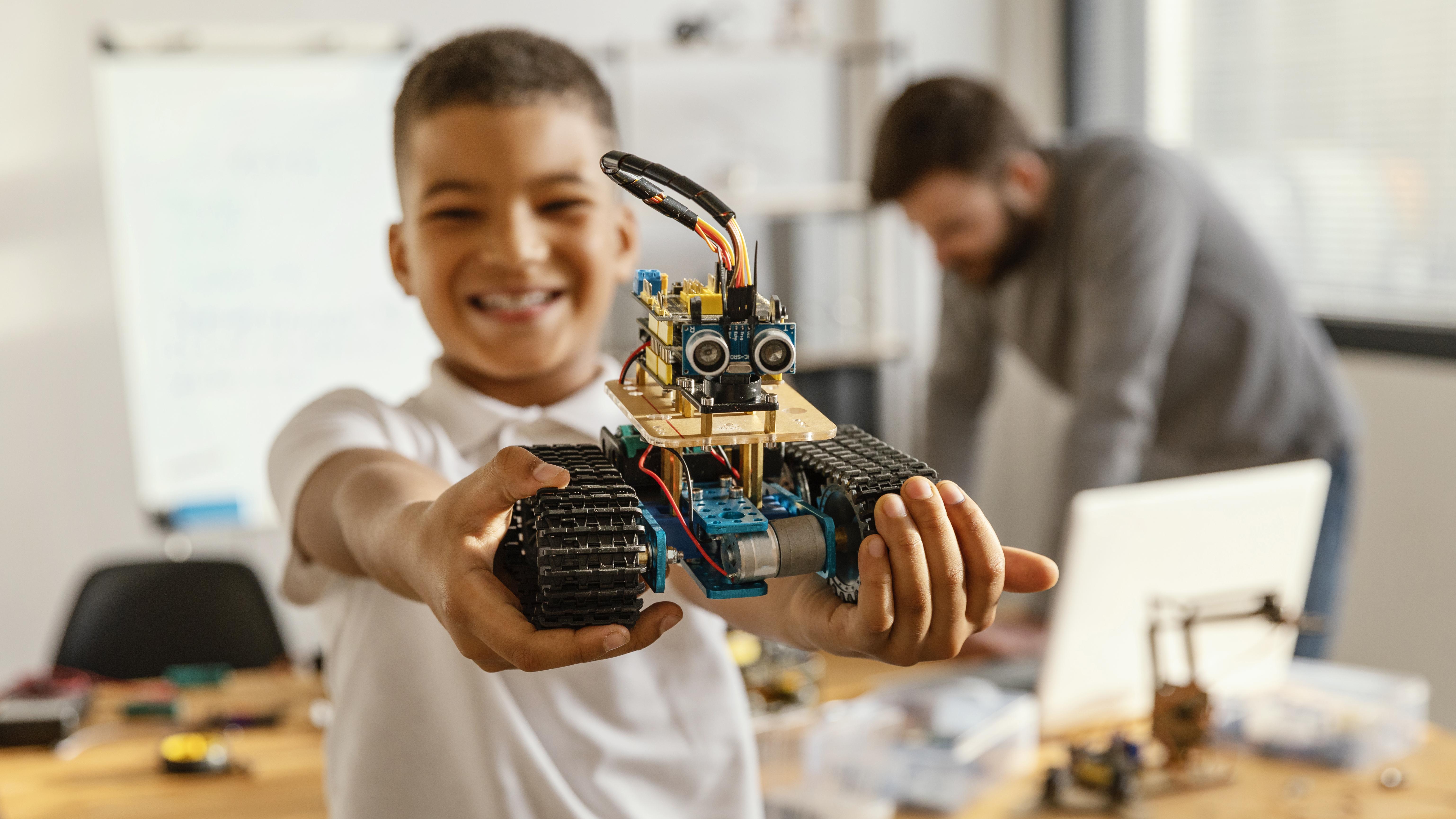 Children collaborating during robotics and STEM activities